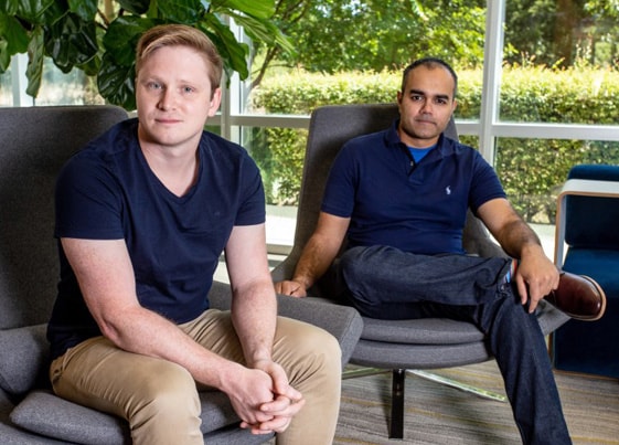 Jared King and Parag Patel sitting next to each other, the founders of Invoiced